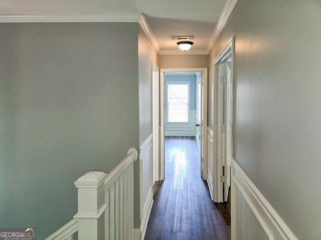 hall featuring dark hardwood / wood-style flooring and crown molding