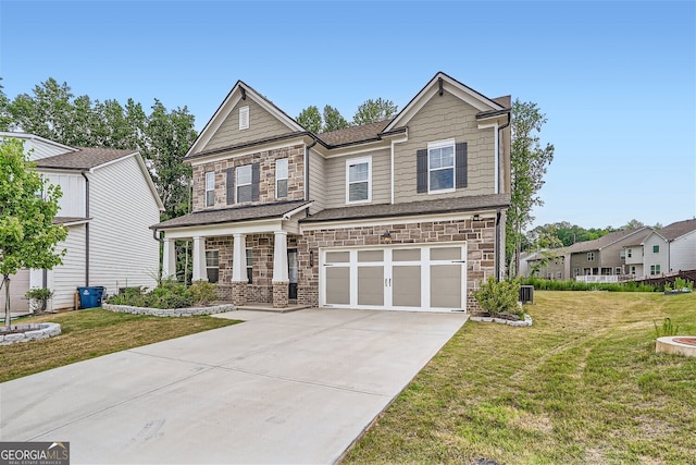 view of front of property with a garage and a front lawn