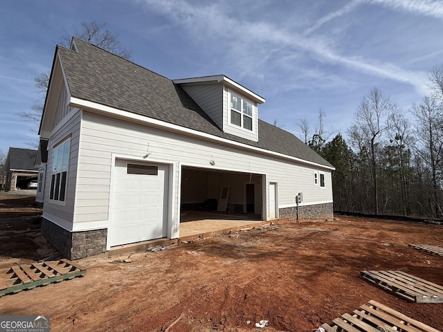 view of property exterior featuring a garage