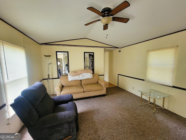 living room featuring carpet floors, vaulted ceiling, and a healthy amount of sunlight