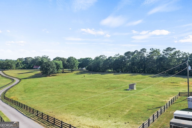 view of community featuring a yard and a rural view