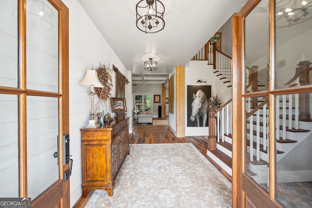 entryway featuring a chandelier and hardwood / wood-style floors