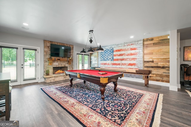 playroom with french doors, wood walls, dark hardwood / wood-style floors, billiards, and a fireplace