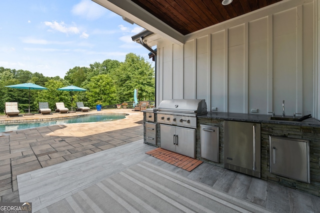 view of patio / terrace featuring sink and area for grilling