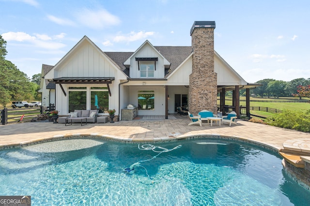 view of pool with a patio and an outdoor hangout area