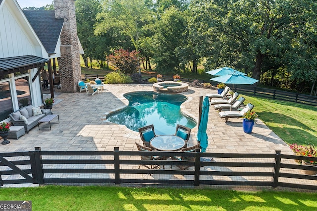 view of pool with an in ground hot tub, a patio, and an outdoor hangout area