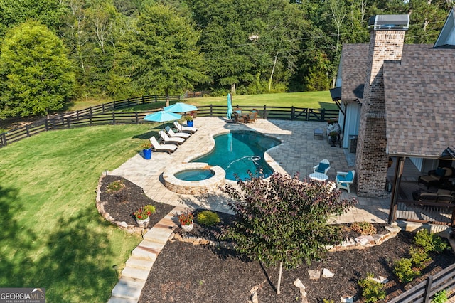 view of pool featuring a yard and a patio area