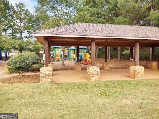 view of property's community featuring a playground, a gazebo, and a yard