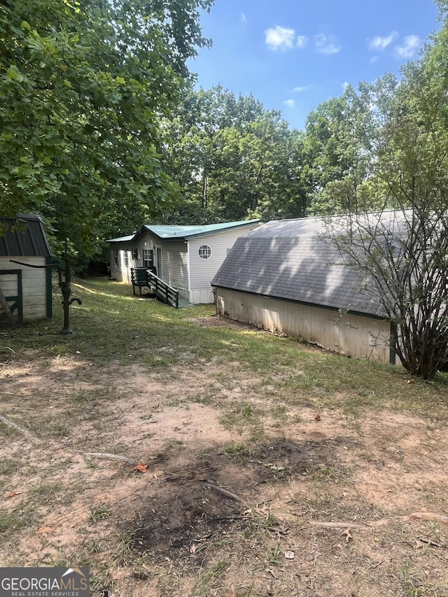 view of side of home with an outbuilding