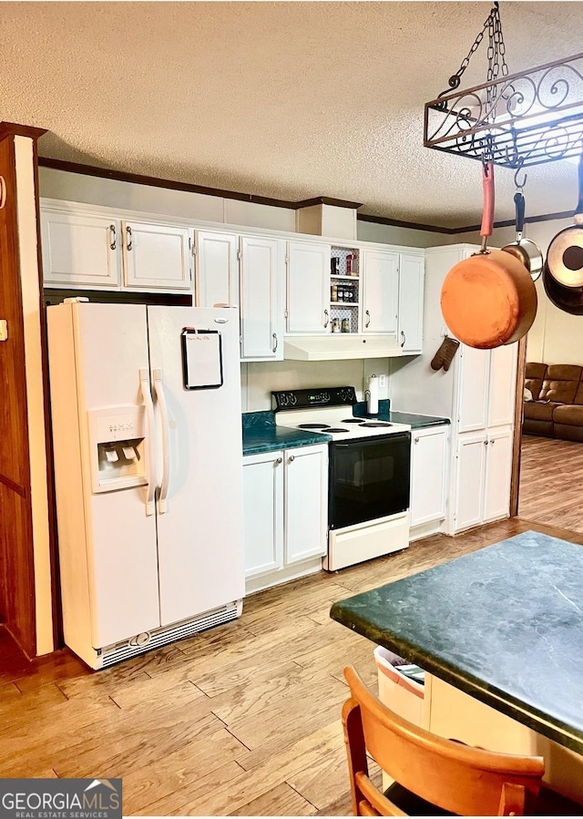 kitchen with electric range oven, white refrigerator with ice dispenser, light wood-type flooring, and white cabinets