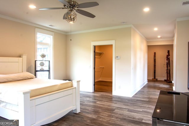 unfurnished bedroom featuring dark wood-style floors, recessed lighting, visible vents, and ornamental molding