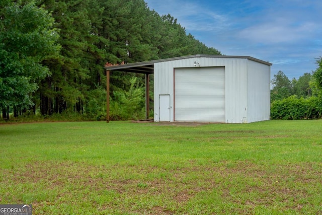 view of outbuilding featuring driveway and an outdoor structure