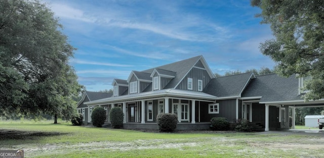 view of front facade featuring a front lawn and an attached carport