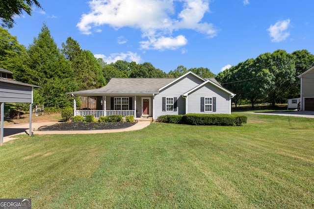 ranch-style house featuring a front lawn, a carport, and covered porch