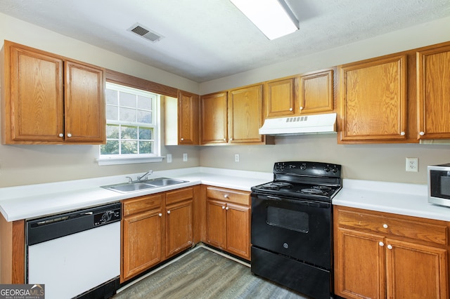 kitchen featuring dark hardwood / wood-style floors, sink, black electric range oven, and dishwasher