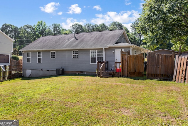 back of house featuring a yard, cooling unit, and a deck