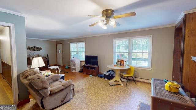 living room with ornamental molding, a baseboard radiator, hardwood / wood-style flooring, and ceiling fan