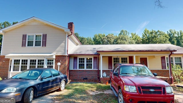 5110 Macland Rd, Powder Springs, GA 30127 - view of front of house with brick siding, a chimney, and crawl space