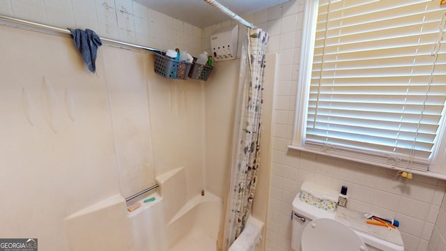 5110 Macland Rd, Powder Springs, GA 30127 - bathroom with tile walls, toilet, and shower / bathtub combination with curtain