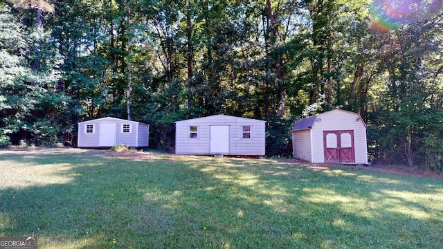 5110 Macland Rd, Powder Springs, GA 30127 - view of green lawn featuring a shed and an outbuilding