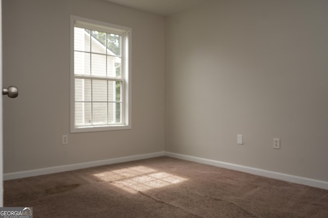 spare room featuring carpet