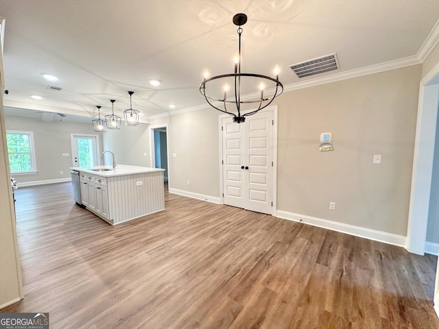 1344 Mooty Bridge Rd, Lagrange, GA 30240 - kitchen with ornamental molding, a chandelier, dishwasher, light wood-type flooring, and a center island with sink