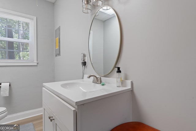 bathroom featuring toilet and vanity