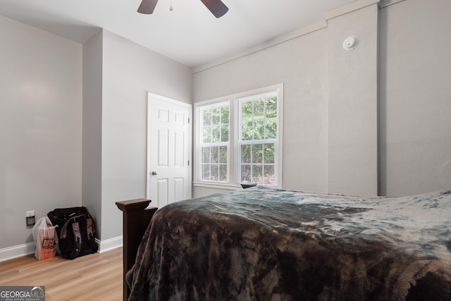 bedroom with ceiling fan and light hardwood / wood-style flooring