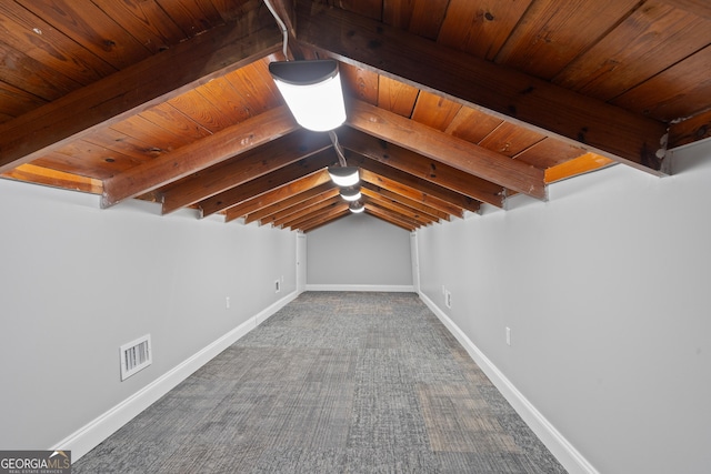 additional living space featuring wood ceiling and vaulted ceiling with beams