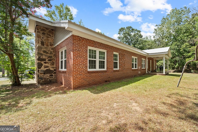 view of property exterior with a yard