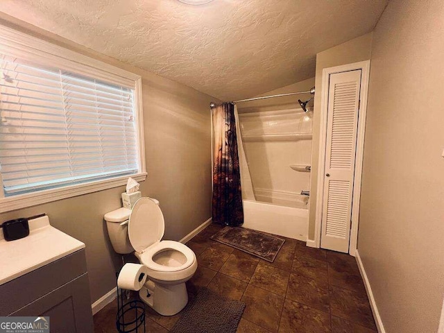 full bathroom with vanity, shower / bath combo with shower curtain, toilet, a textured ceiling, and tile patterned flooring