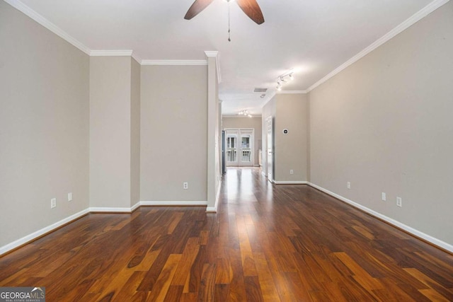 spare room with dark hardwood / wood-style floors, ceiling fan, crown molding, and track lighting