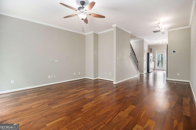 spare room featuring ceiling fan, dark hardwood / wood-style flooring, and ornamental molding