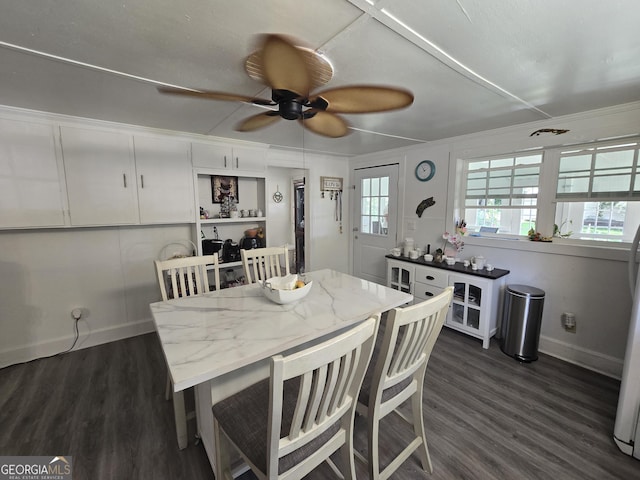 dining space featuring ceiling fan and dark hardwood / wood-style flooring