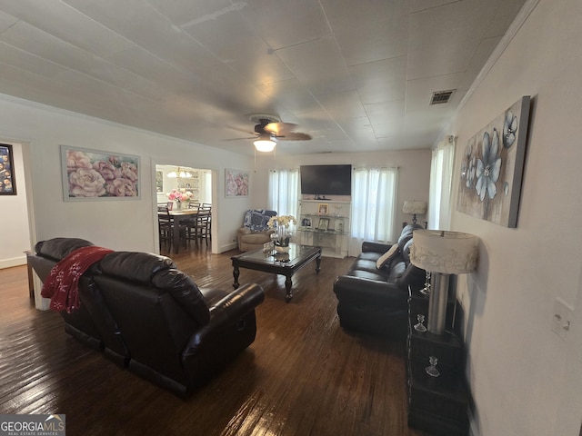 living room with ceiling fan, hardwood / wood-style floors, and crown molding