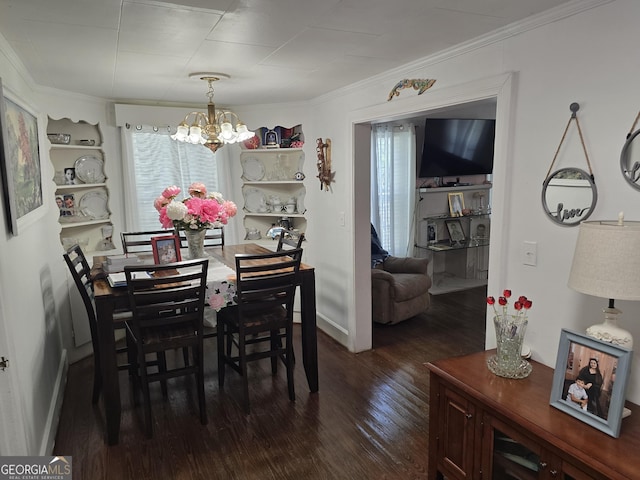 dining area with an inviting chandelier, dark wood-type flooring, and crown molding