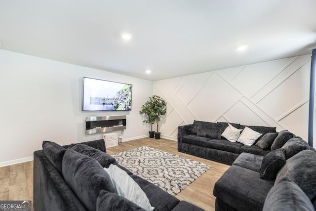 living room with a fireplace and hardwood / wood-style floors