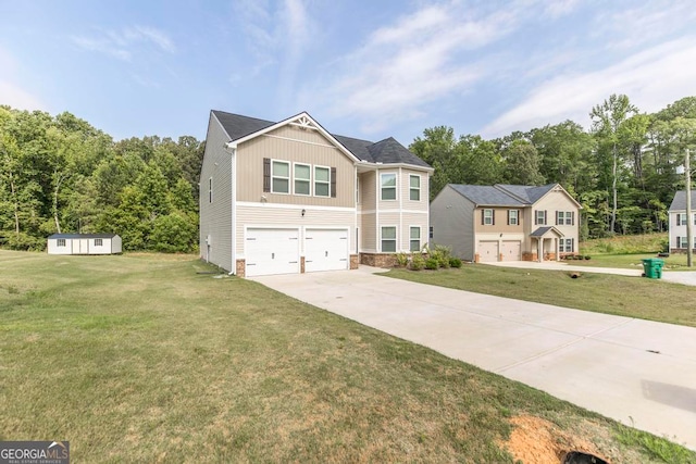 view of front of house featuring a garage, a shed, and a front lawn