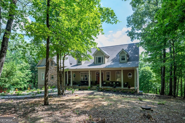 cape cod-style house with a porch