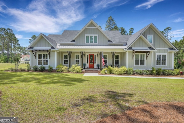 craftsman inspired home with a porch and a front lawn