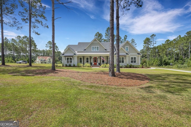 craftsman inspired home with a front yard and covered porch