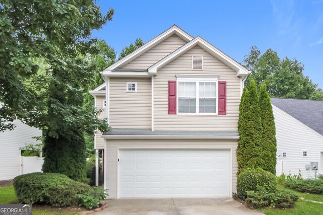 front of property with a garage