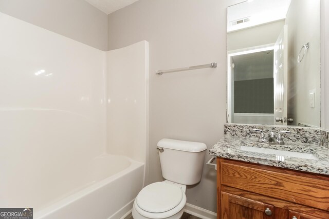 full bathroom featuring toilet, tub / shower combination, and vanity