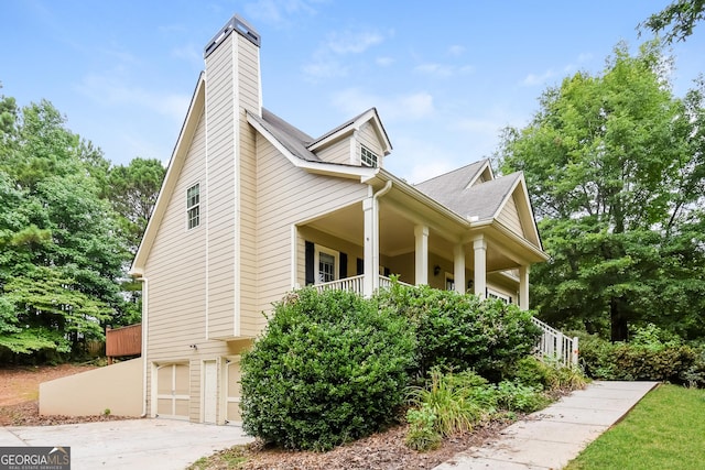 view of side of property with a garage