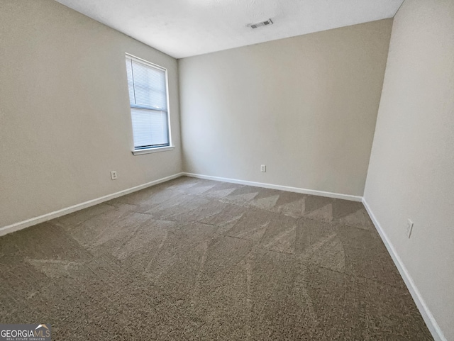 unfurnished room with carpet floors