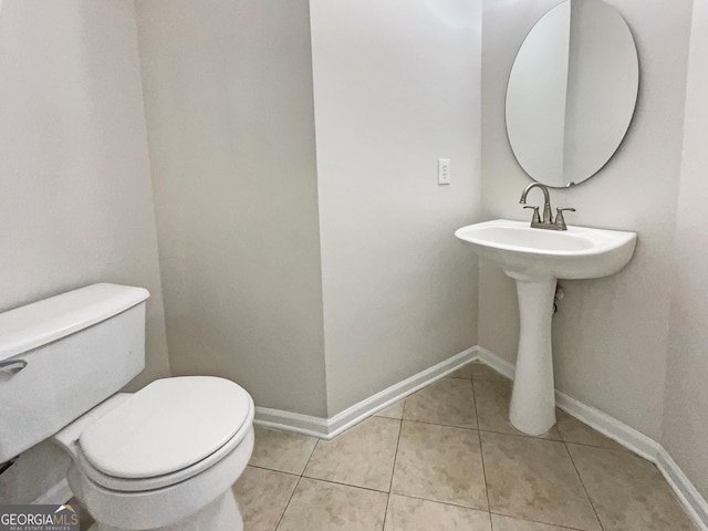 bathroom featuring tile patterned floors and toilet