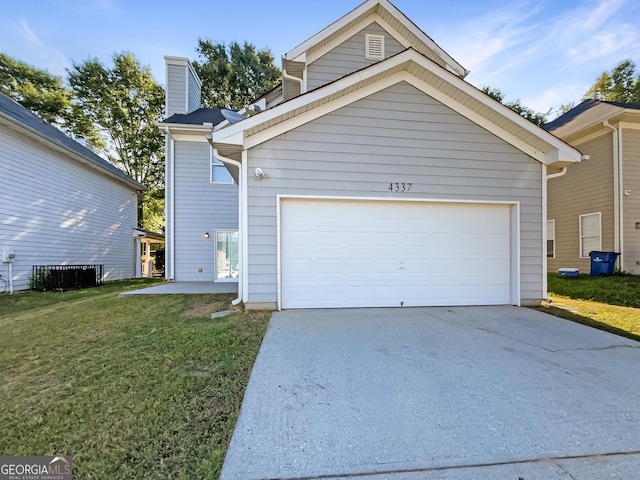 view of front of property with a garage and a front yard