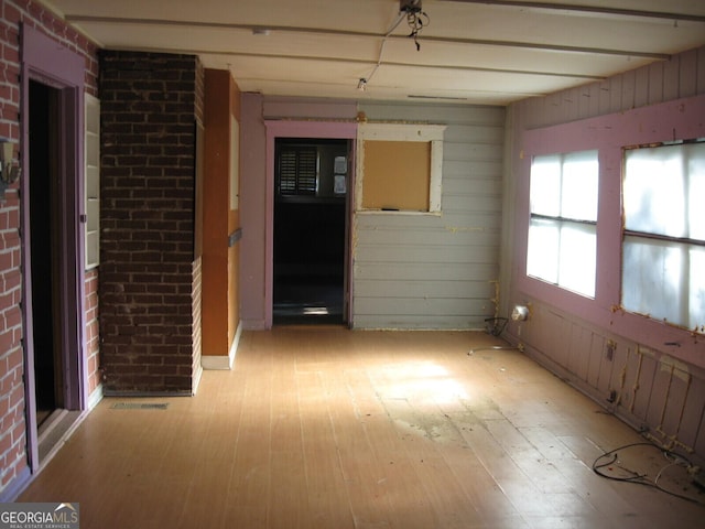 unfurnished room featuring light hardwood / wood-style floors