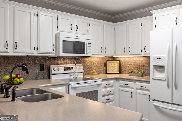 kitchen featuring backsplash, sink, crown molding, white cabinets, and white appliances