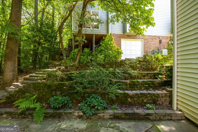 view of yard with central air condition unit